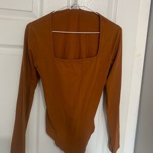 Brown body suit